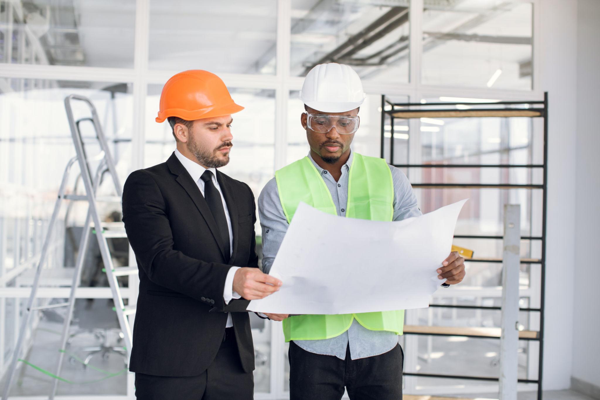 Commercial construction professionals reviewing project plans